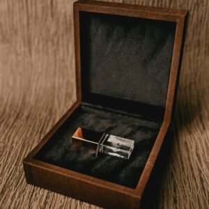 Creative design of square shaped box with thumb drive for gift on rough brown background